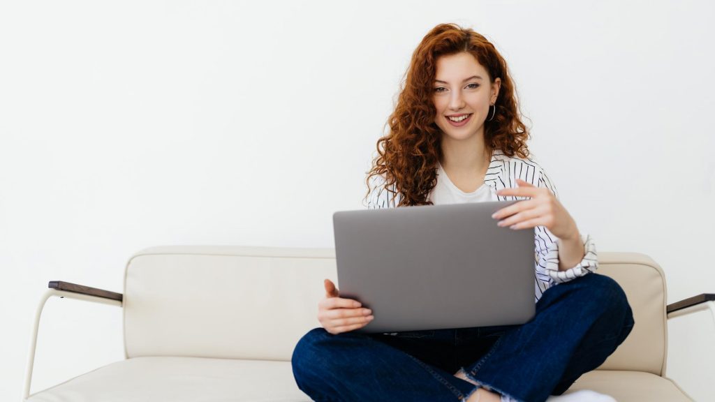 young woman with laptop work from home