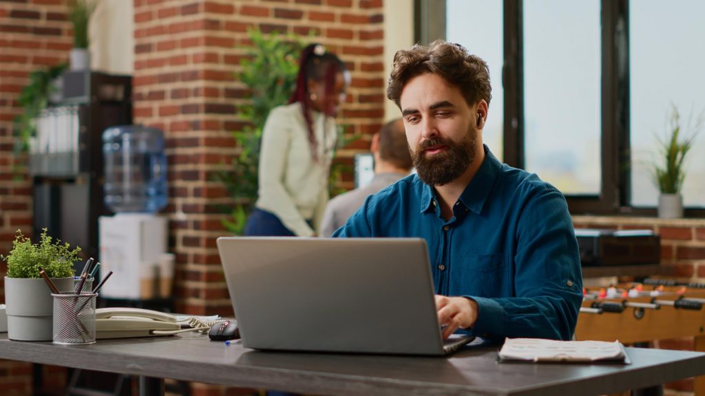 business man talking online using laptop computer