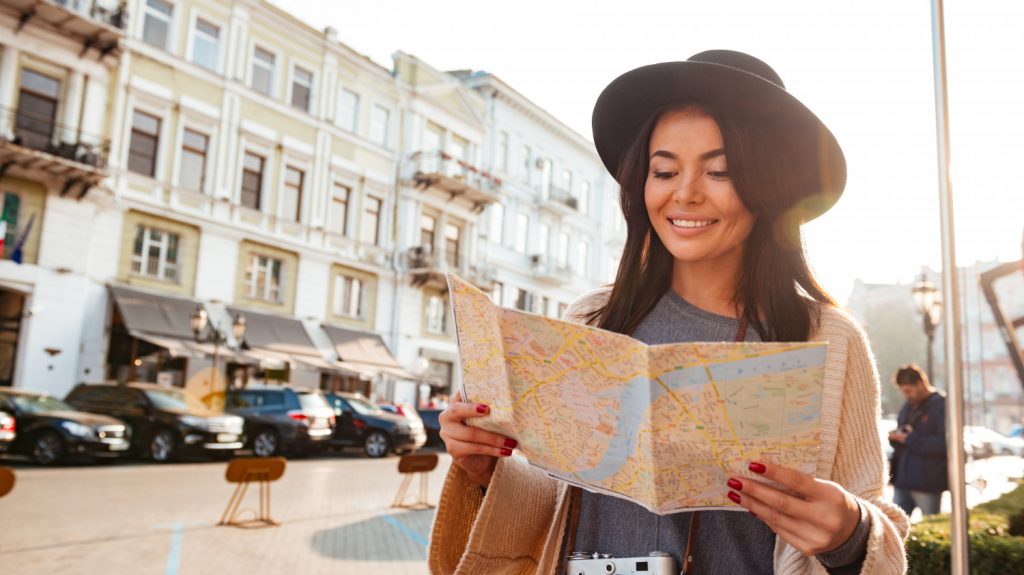 woman traveling looking at map tourist