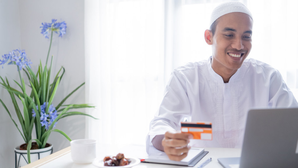man using SmartAccess Prepaid Visa Debit Card for online purchase